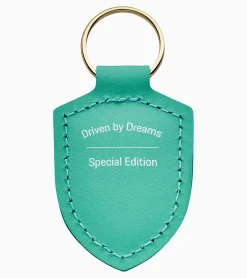 Schlusselanhanger Wappen „Driven By Dreams" – 75Y